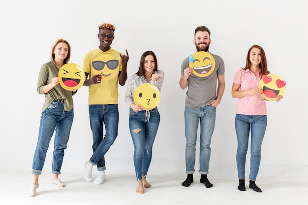 Free Photo front view group of friends with emoji