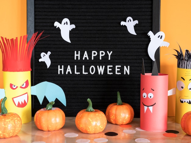 Free photo front view halloween concept with greeting