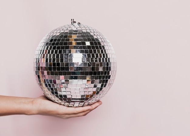 Free Photo front view of hand held disco ball