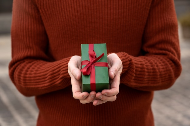 Front view hands holding present