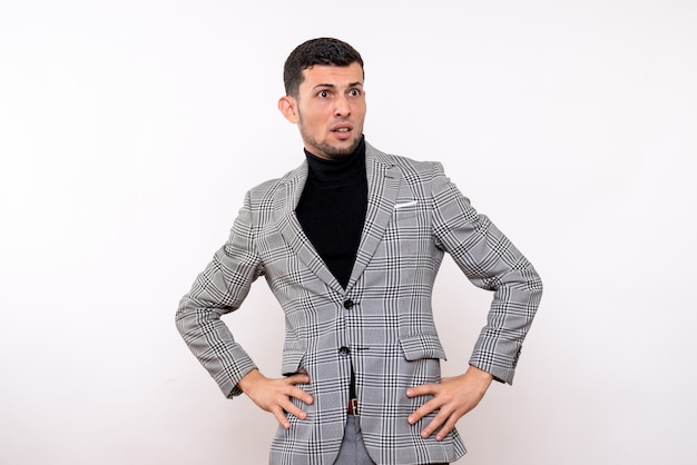 Free Photo front view handsome male in suit putting hands on a waist standing on white background