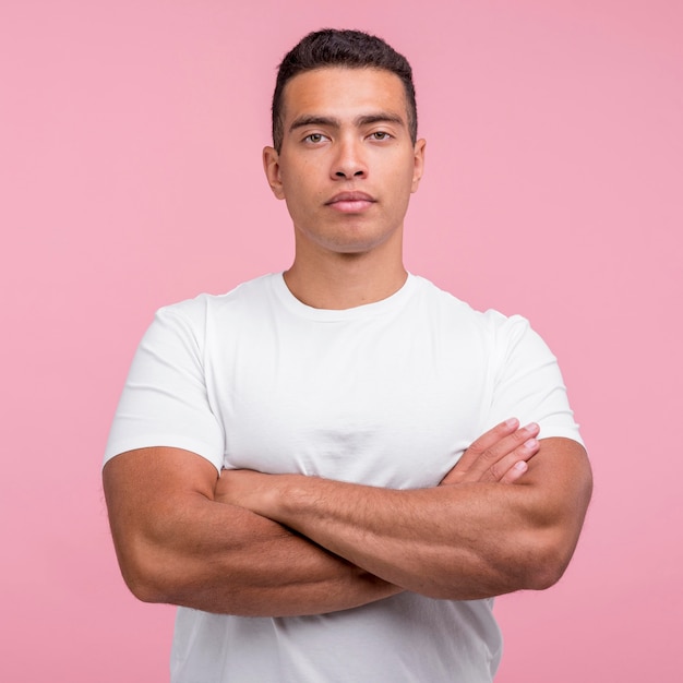 Front view of handsome man posing with his arms crossed