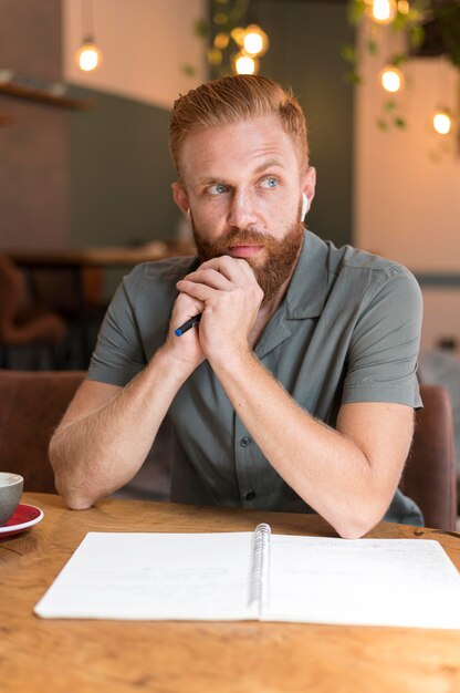 Front view handsome modern man being thoughtful