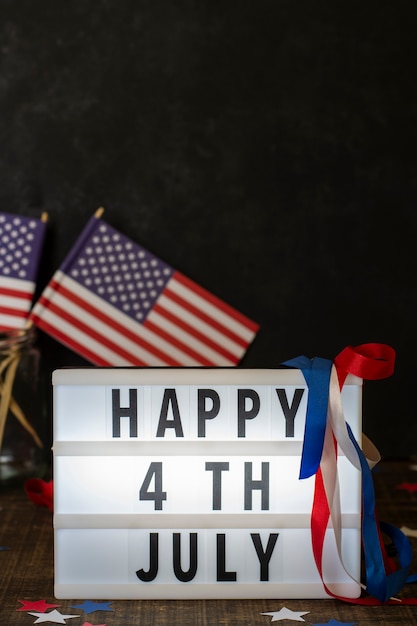 Free Photo front view happy 4th july sign with flags and copy-space