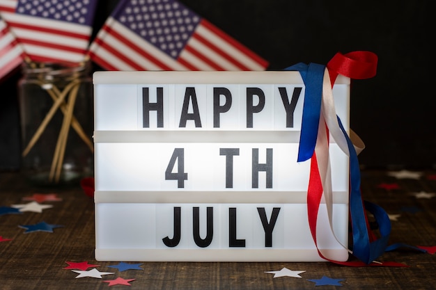 Free Photo front view happy 4th july sign with flags