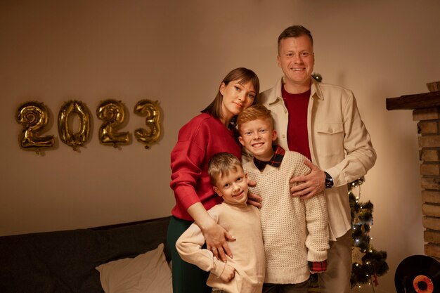 Front view happy family posing indoors