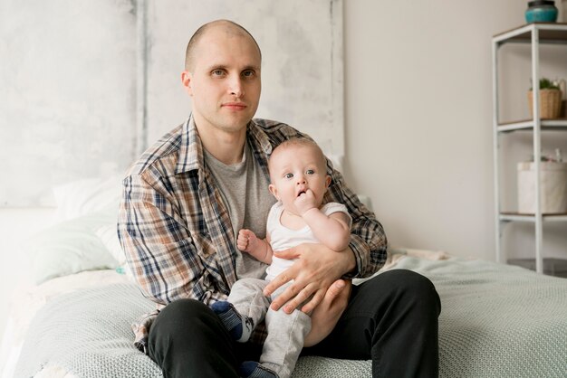 Front view of happy father and child