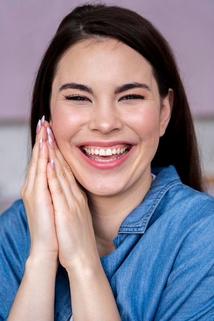 Front view of happy woman laughing