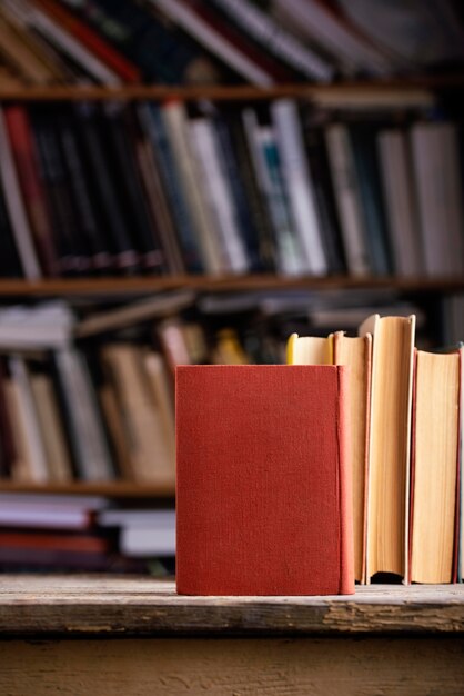 Front view of hardback books with copy space in the library