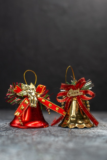 Free Photo front view holiday bells on light-grey table