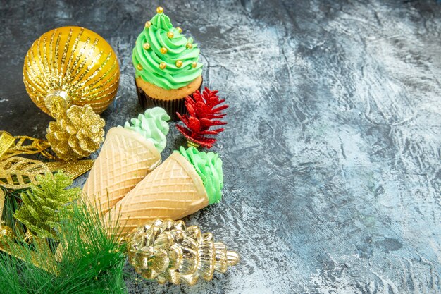 Front view ice creams xmas tree cupcake xmas ornaments on grey background