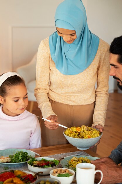 Front view islamic family with delicious food