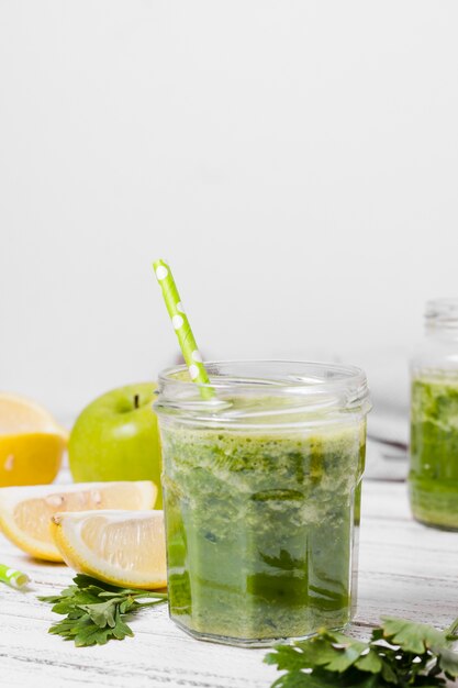 Front view of jar of healthy smoothie with apple