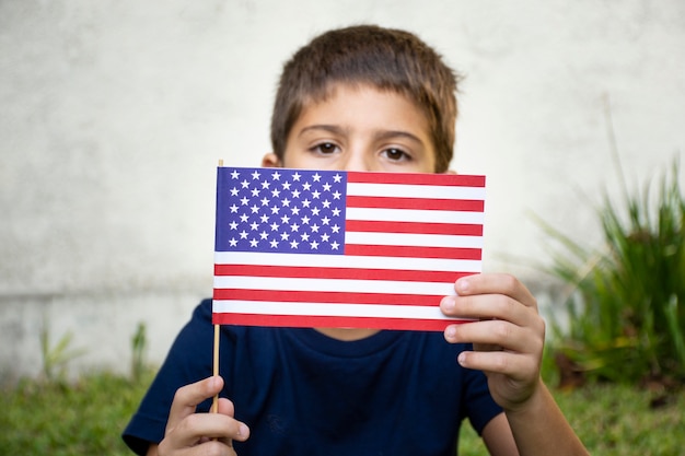 Front view kid holding usa flag