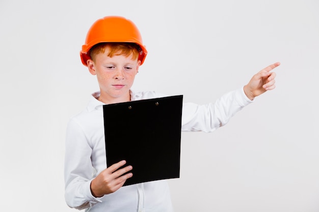 Free photo front view kid posing as construction worker