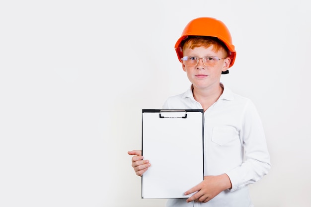 Front view kid with helmet and clipboard