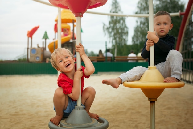 Free photo front view kids playing in park