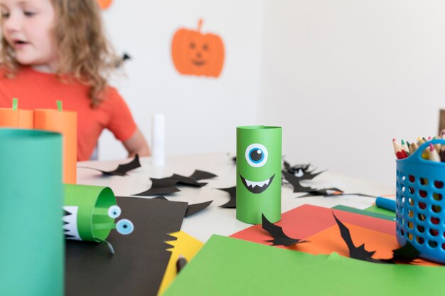 Front view of kids with halloween concept arrangements