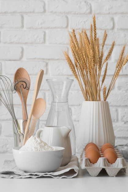 Free Photo front view kitchen tools arrangement and eggs