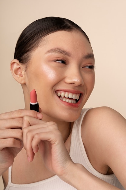 Front view korean woman posing with lipstick