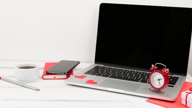 Front view of laptop with clock and agenda