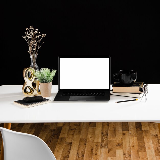 Front view of laptop on wooden table