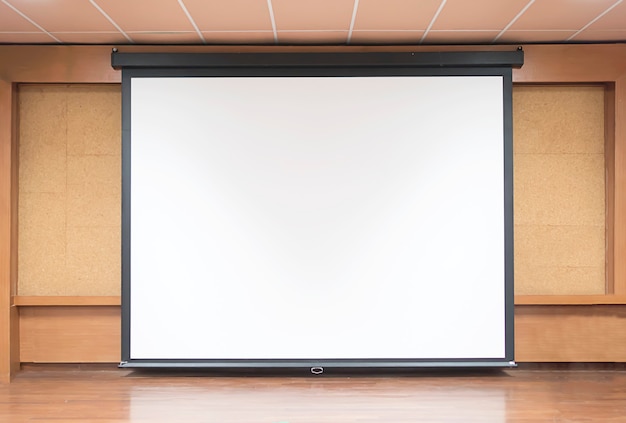 Free photo front view of lecture room with empty white projector screen