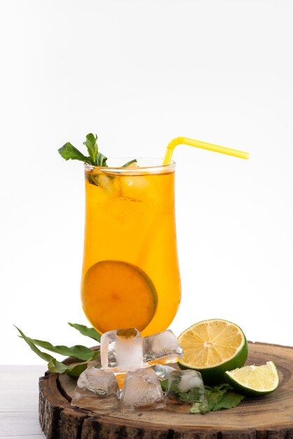 A front view lemon cocktail with ice cubes and straw on white, drink juice color