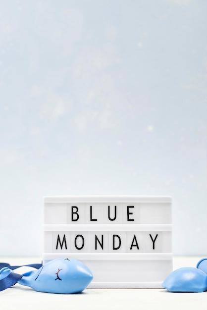 Free Photo front view of light box with copy space for blue monday