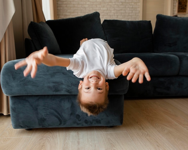 Free photo front view little boy having fun at home