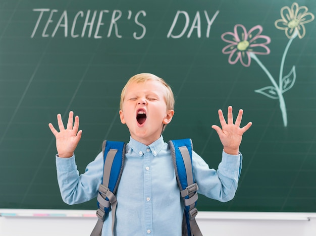 Free photo front view little boy screaming in class