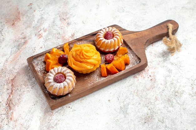 Front view little cakes perfect dessert for tea with fruits on white background tea pie cake dessert sweet cookie