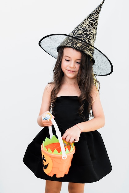 Free Photo front view little girl in witch costume for halloween