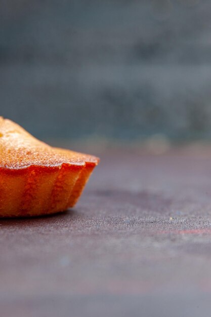 Free Photo front view little yummy cake on the dark background pie biscuit cake sweet cookie sugar tea