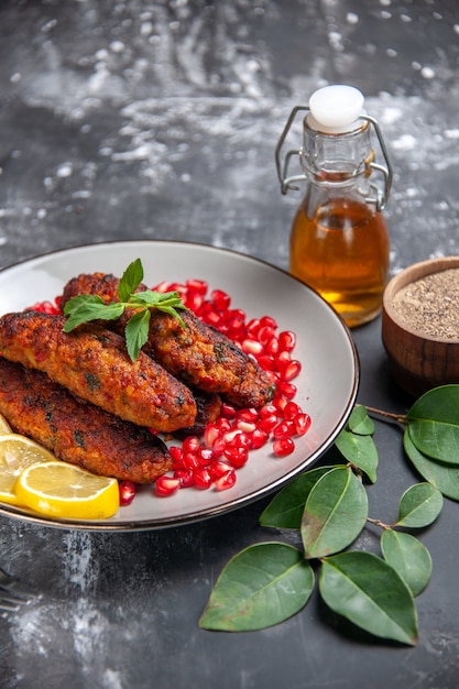 Front view long meat cutlets with seasonings