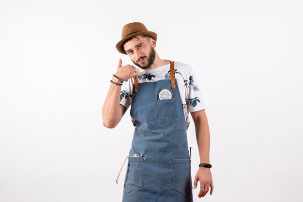 Front view male bartender just standing and asking to call on white wall alcohol job club night drink bar