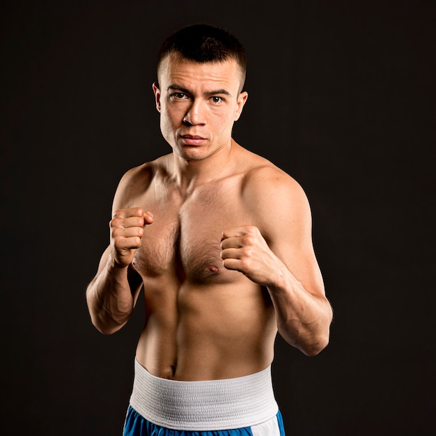 Free photo front view of male boxer posing