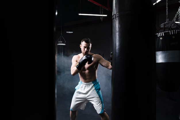 Front view male boxer training for a competition