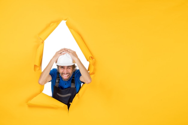 Free Photo front view male builder in uniform on yellow background