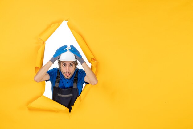 Free Photo front view male builder in uniform on yellow background