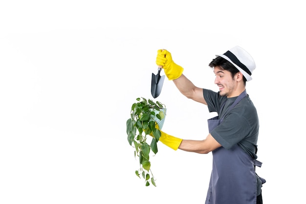 Front view male gardener holding little plant in pot and spatula on a white background work ground tree flower grass job color garden bush