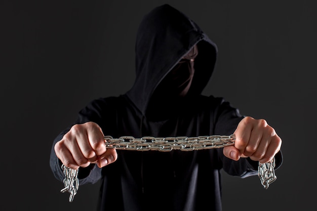 Free Photo front view of male hacker holding metal chain