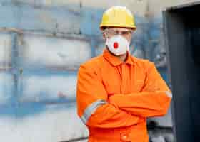 Free photo front view of male laborer with hard hat and copy space