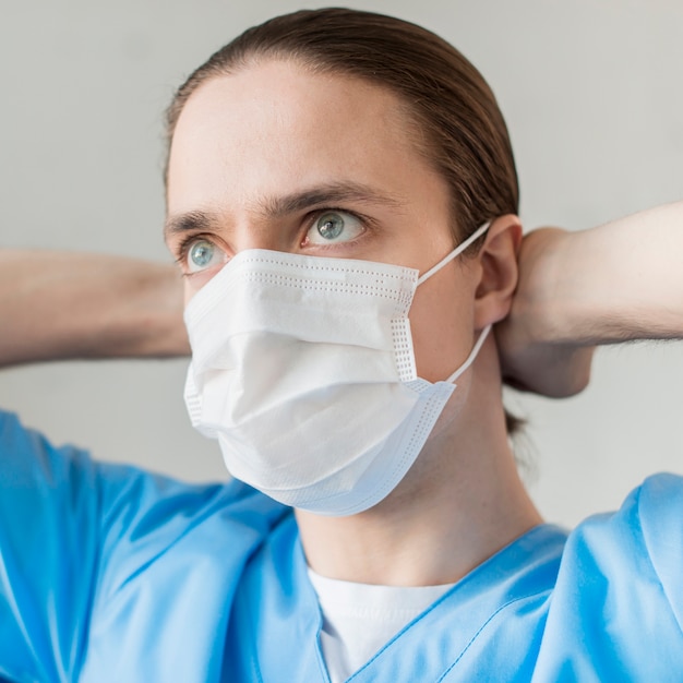 Front view male nurse with medical mask