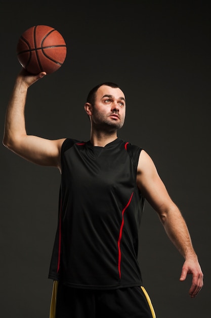 Free photo front view of male player throwing basketball