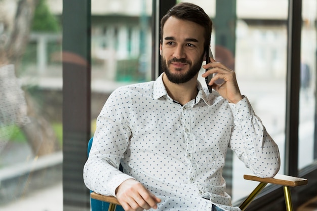 Front view male talking over phone