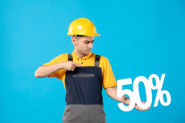 Front view of male worker in uniform with writing blue 