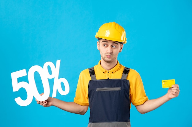 Front view male worker in uniform with writing and credit card blue 