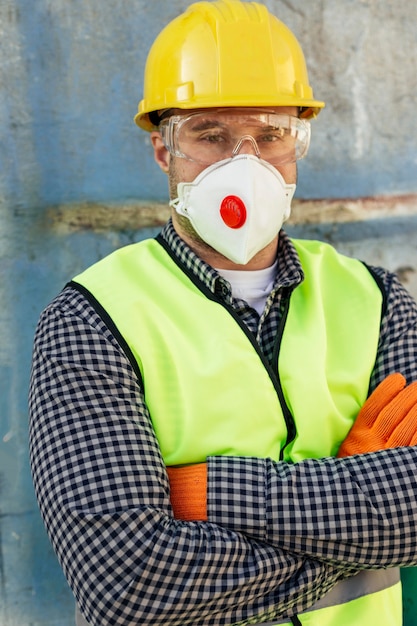 Free Photo front view of male worker with protective glasses and reflective vest