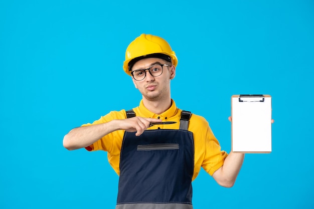 Free Photo front view of male worker in yellow uniform on blue 